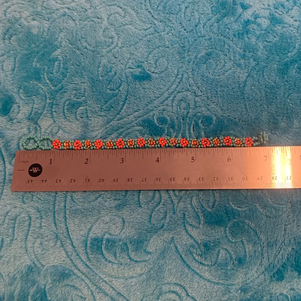 6 1/2 inch coral/blue/gold beaded bracelet